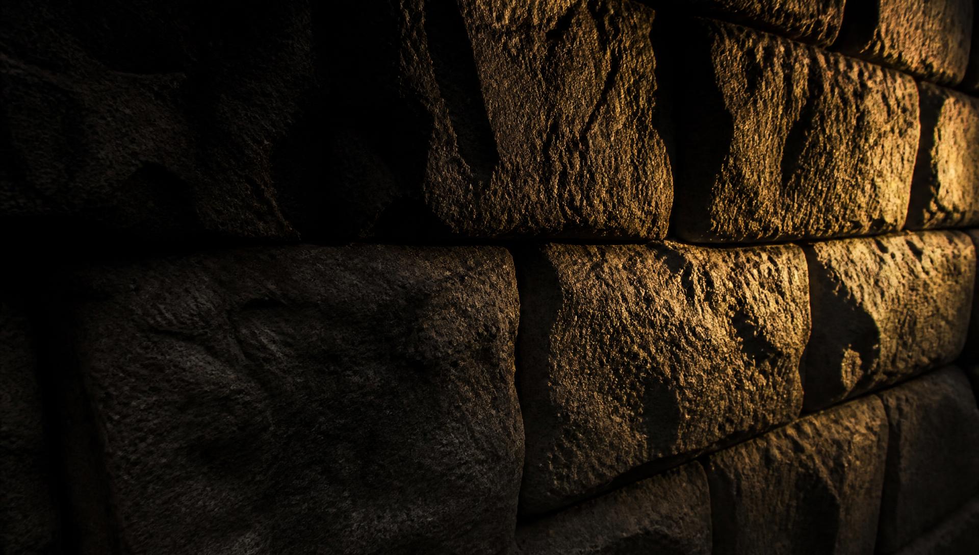 Close-up of a golden-lit stone wall